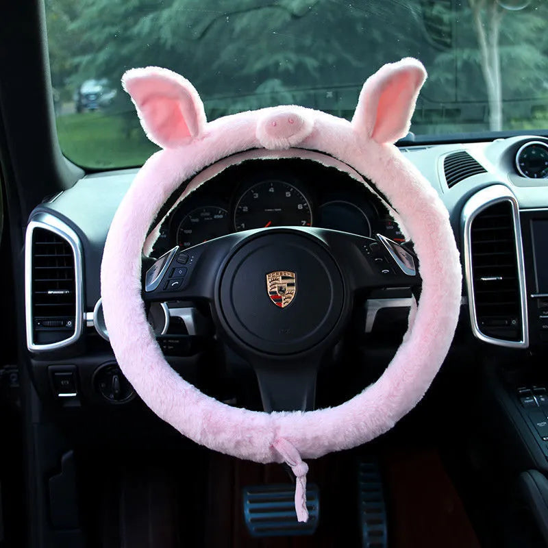 Cute cat ear steering wheel cover in short plush cashmere wool, black colour, on a steering wheel
