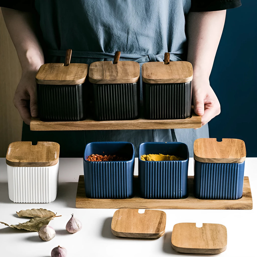 Ceramic seasoning jar set with matte glaze and natural log accents in black, blue, and white