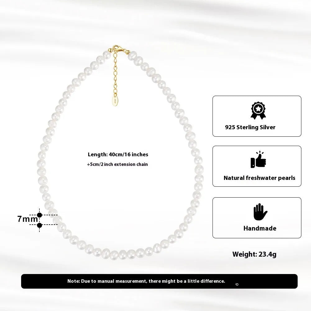 Close-up of a women's adjustable silver necklace with a natural freshwater pearl centrepiece.