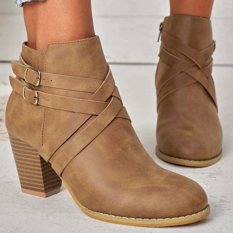 Grey plus size ankle boot with a 7cm chunky heel, side zipper, and buckle detail on a plain toe.