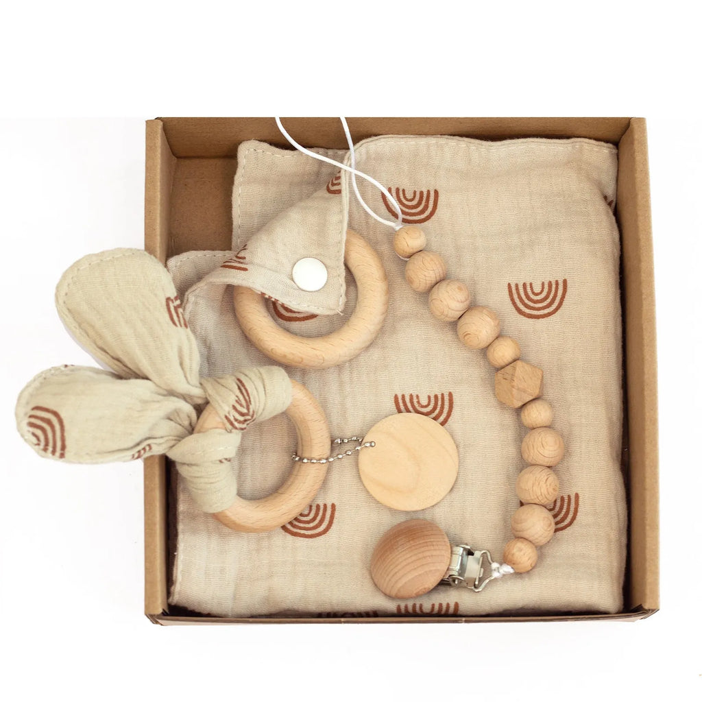 Baby teething gift set with bamboo gauze blanket, wooden chewing ring, woven bell, and developmental toys