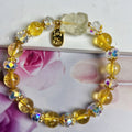 Handmade women's bracelet featuring a nine-tail fox design made from natural citrine crystals.