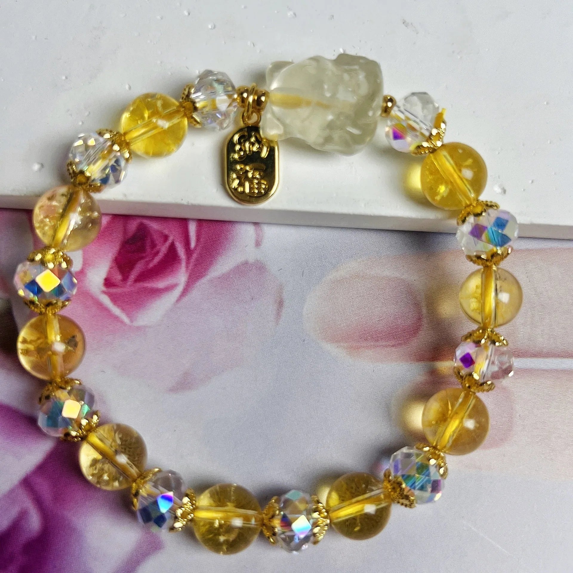 Handmade women's bracelet featuring a nine-tail fox design made from natural citrine crystals.