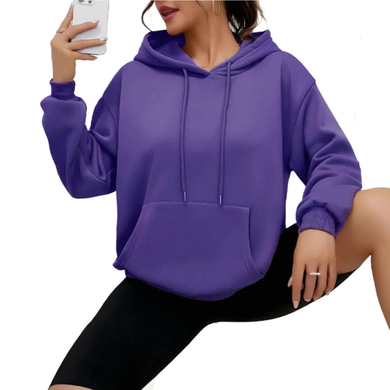 Women's loose grey sweatshirt with a drawstring hem and side pockets, laid flat.