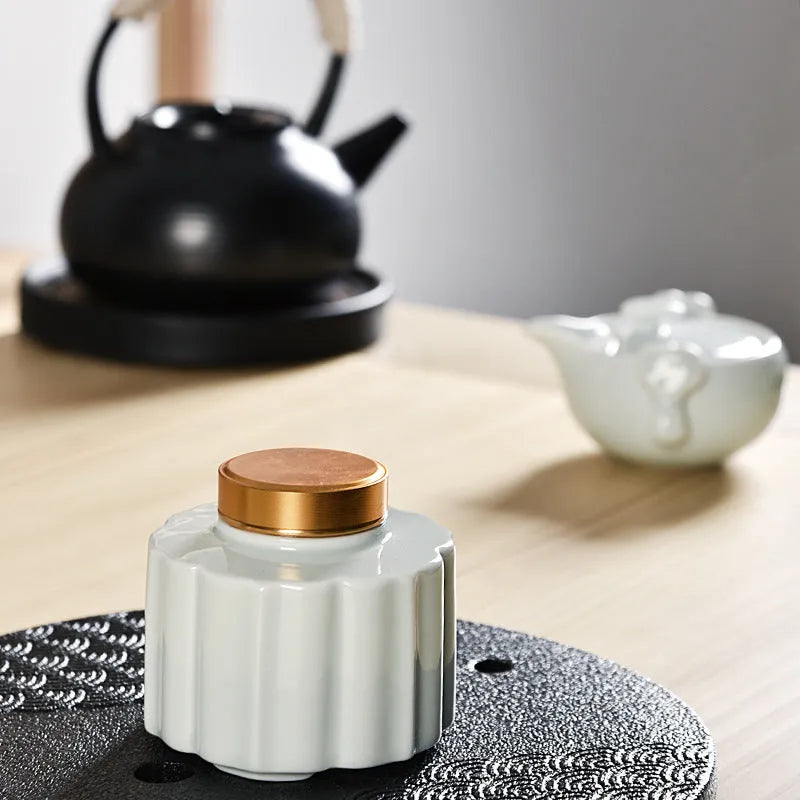 Ceramic tea pot lotus leaf kiln transmutation tea caddy with coloured glaze in celadon colour