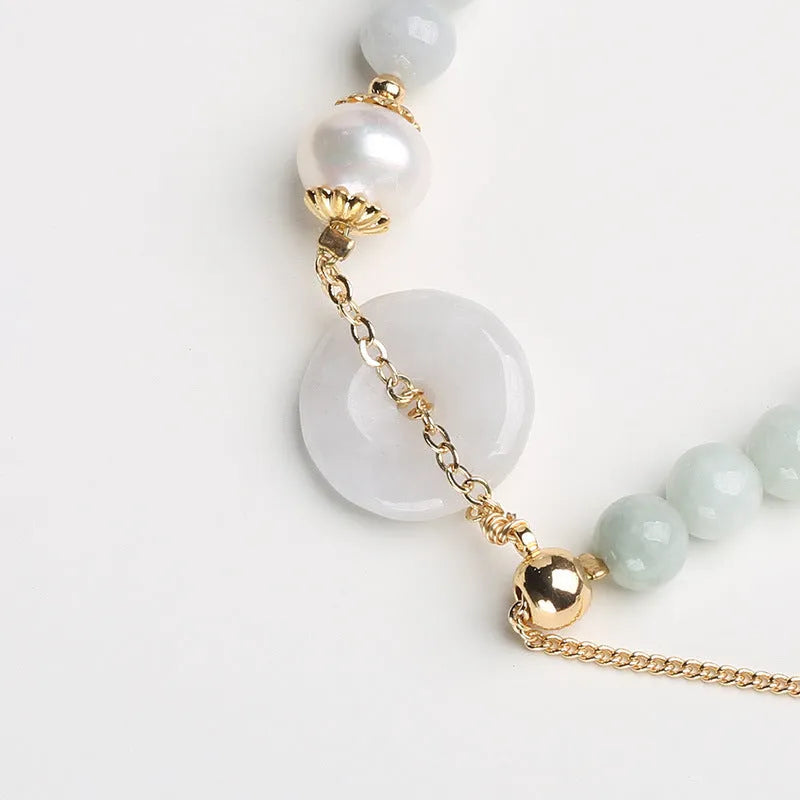 Natural emerald jade peace buckle bracelet with pearl accents and geometric pendant design