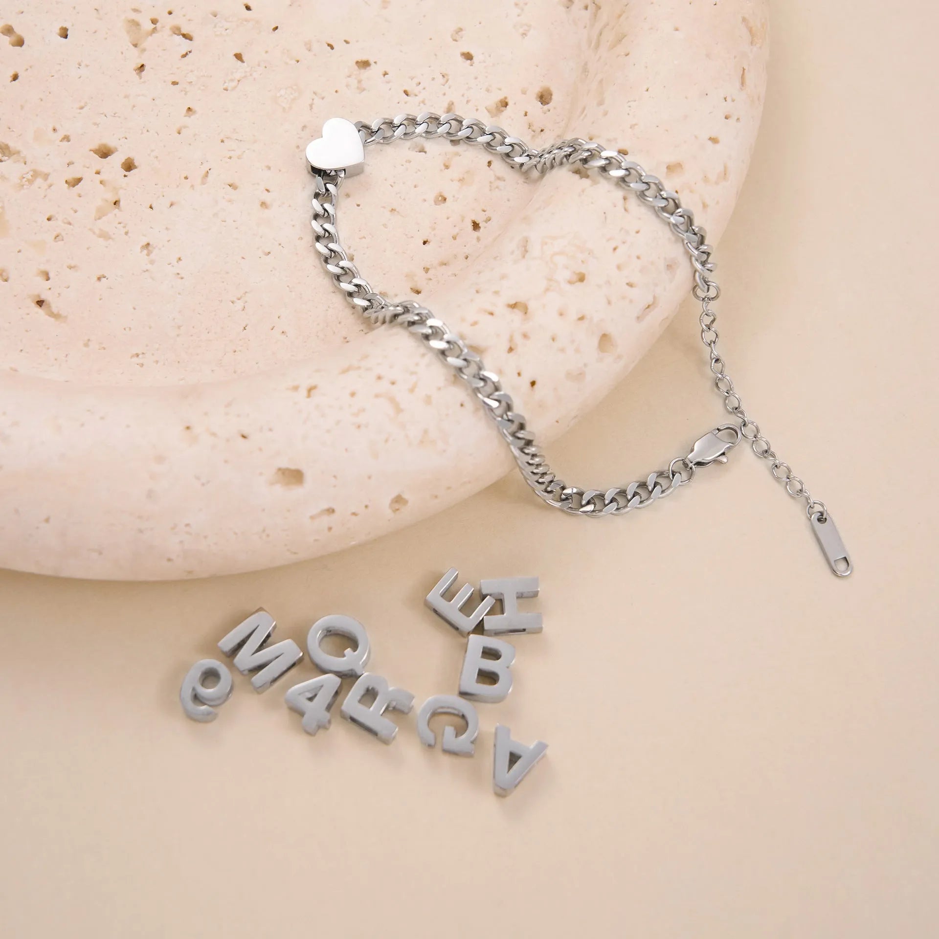 Gold electroplated titanium steel necklace with the letter 'A' pendant on a 40.5 cm chain.
