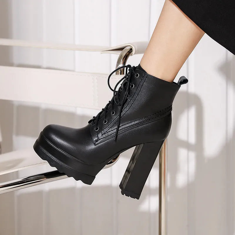 Women's black waterproof cowhide leather ankle boots with a chunky heel and side zip