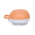 Orange TPR dog bath brush with shampoo dispenser and pumpkin-shaped grip