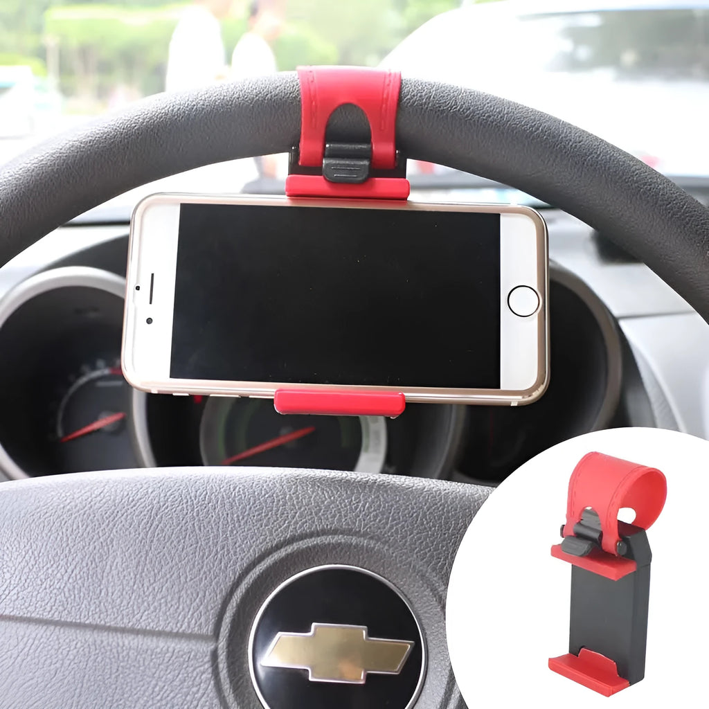 Black universal steering wheel phone clip holder with silicone pad mounted on a car steering wheel.