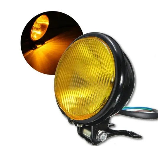 Round bottom mount motorcycle headlight with black aluminium shell, amber glass lens, 12.5 x 8.5 cm, front placement