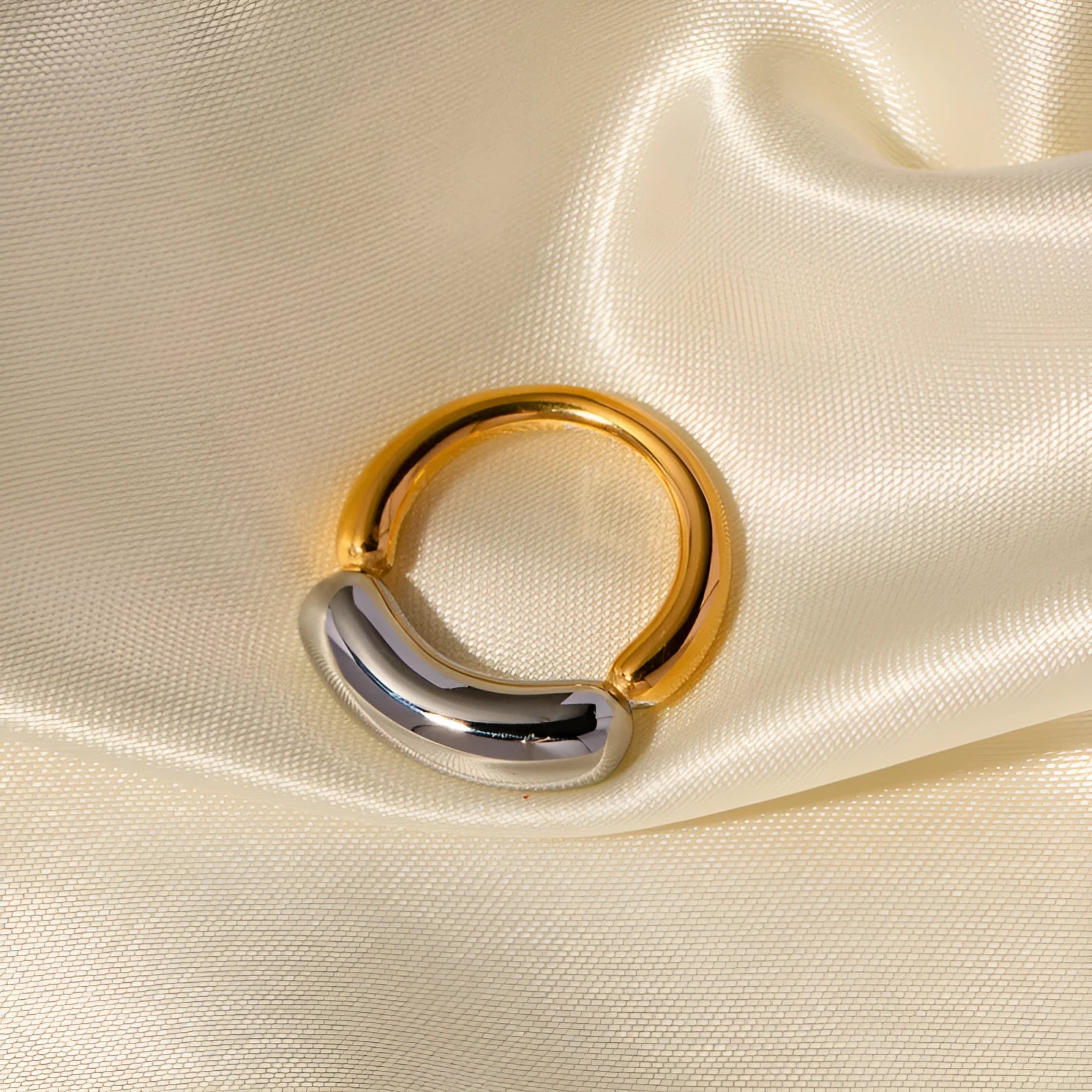 18K gold-plated double-arc geometric stainless steel ring for women on white background