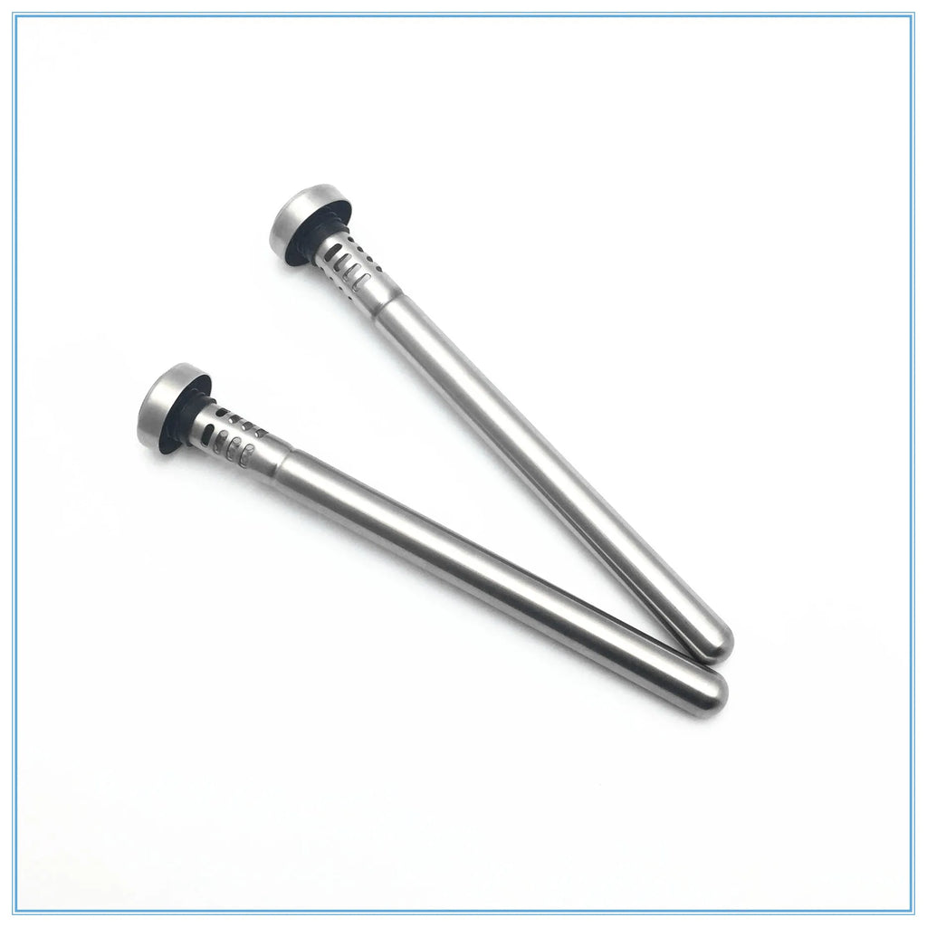 Stainless steel wine cooling rod and pourer in silver, with a bottle of red wine