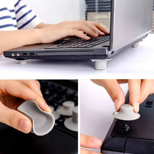 Grey plastic laptop cooling pad set showing two large and two small pads on a wooden desk.