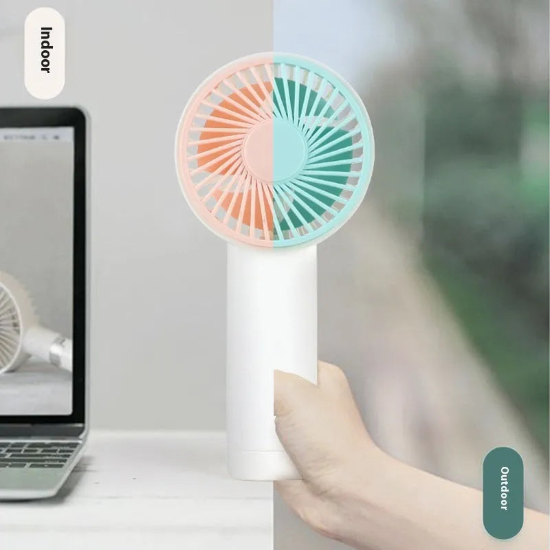Outdoor portable USB rechargeable handheld fan in pink with plastic blades and brushed motor