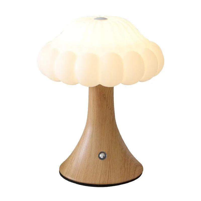 Decorative mushroom-shaped touch lamp in wood grain colour on a tabletop.