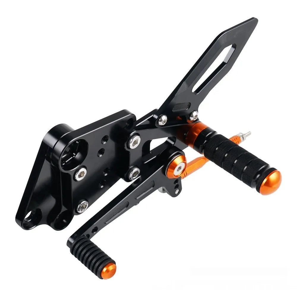 Black and orange KTM DUKE motorcycle footpeg bracket assembly for 125 200 250 390 models