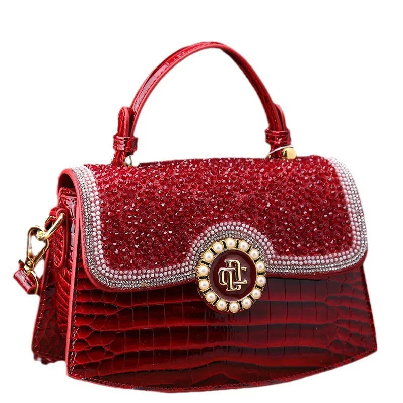 Patent leather diamond portable shoulder bag in black, brown, pink, and red with lock detail and single strap