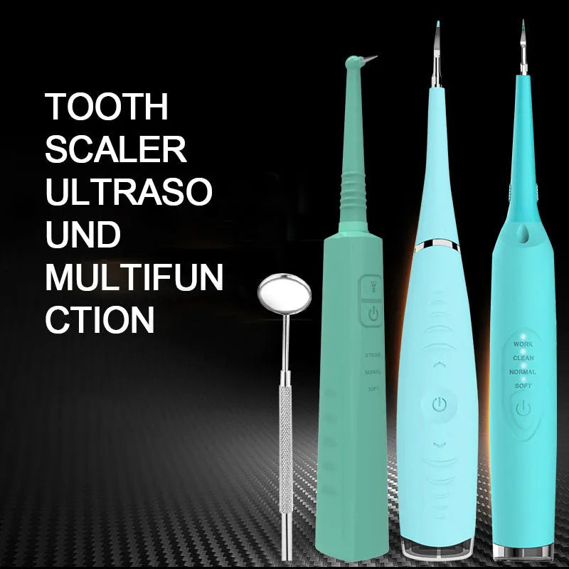 Pink and blue waterproof electric dental scaler with silicone handle and charging cable on a bathroom counter.