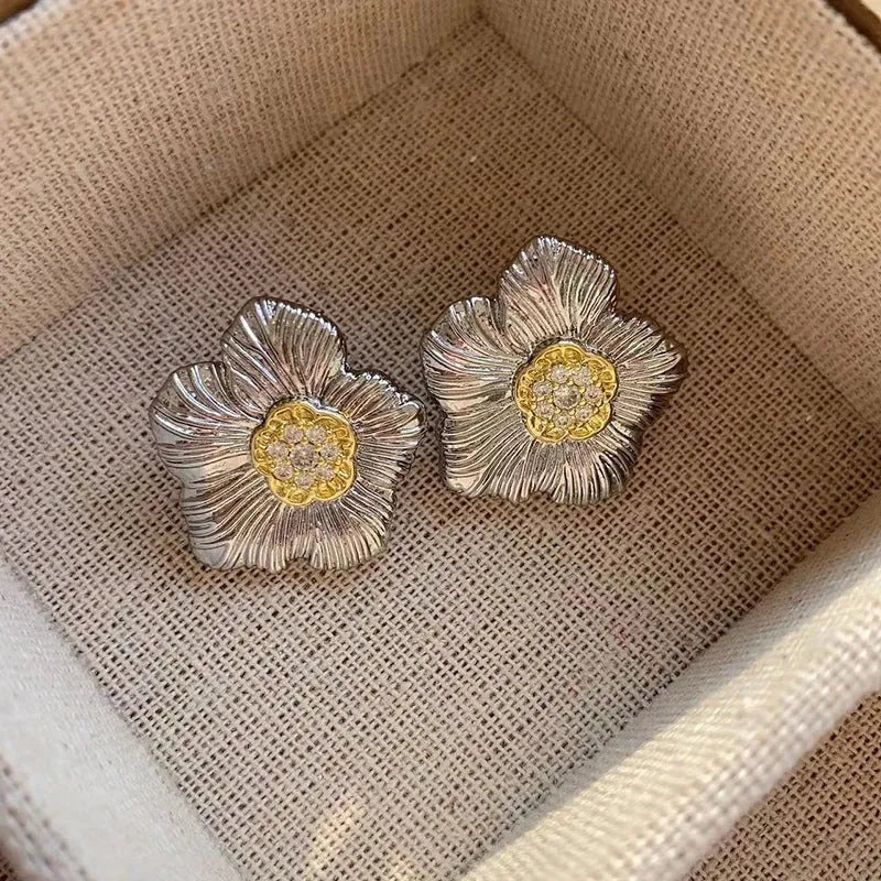 Retro textured gardenia stud earrings with two-tone electroplated finish on copper construction