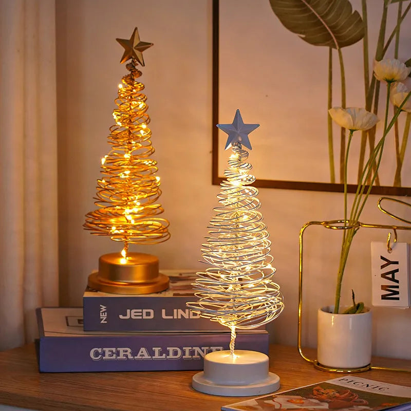 33cm wrought iron Christmas tree spiral light ornament with warm white LED illumination on table