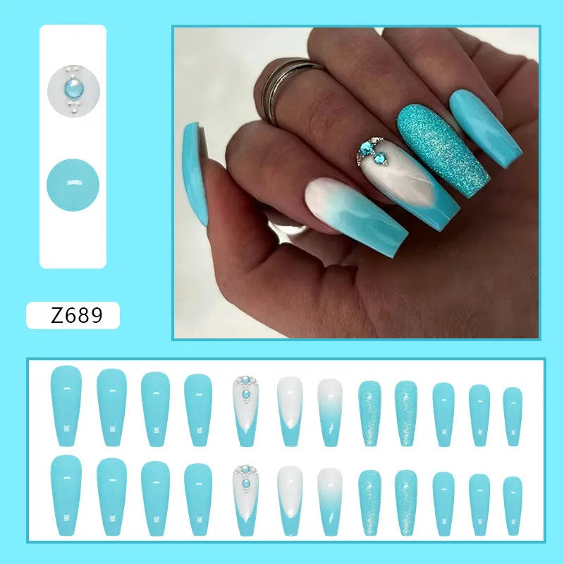 Solid colour long ballet nail art patch with smart blue diamond design on a nail, with glue bottle.
