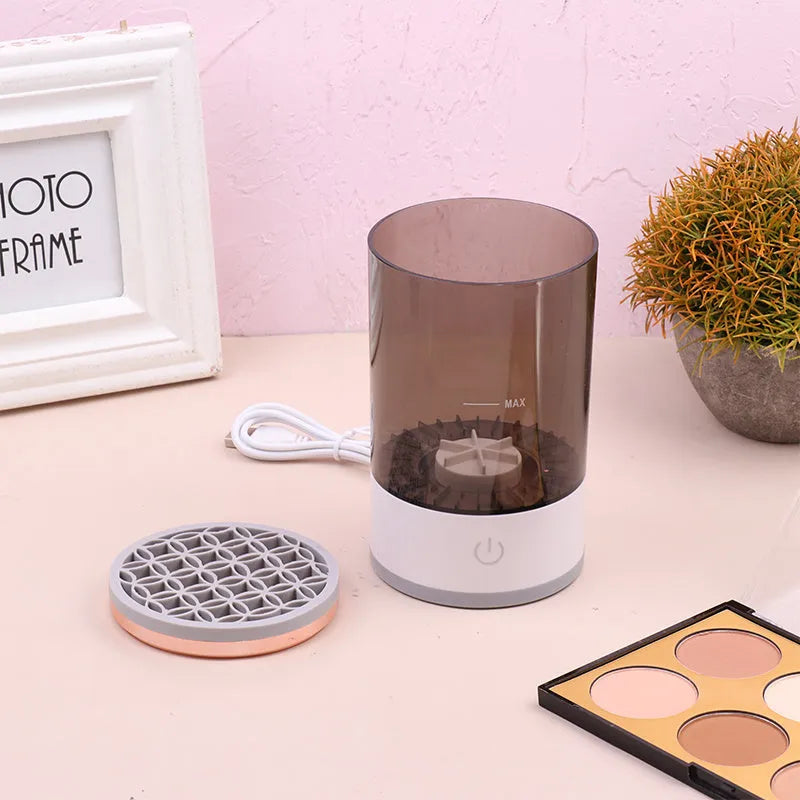 Grey and white electric makeup brush cleaning device with USB charging port