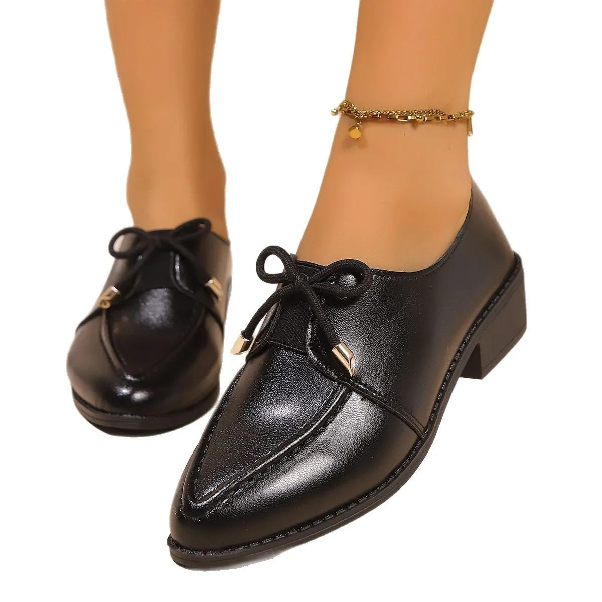 Women's slip-on shoe with a decorative bow on a pointed toe, available in buckle big bow or small bowknot styles.