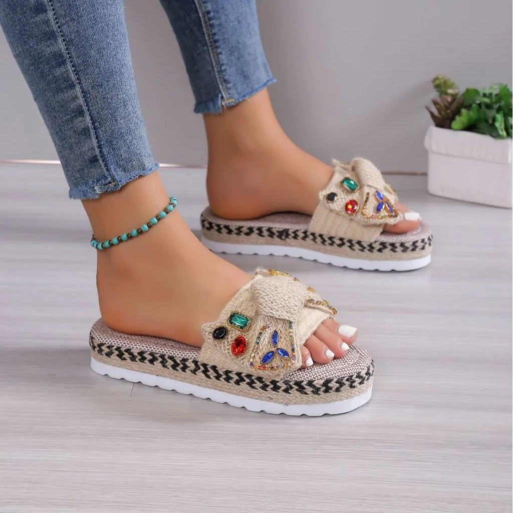 Creamy-white women's platform sandals with a cloth upper, beach bow detail, and a round toe.