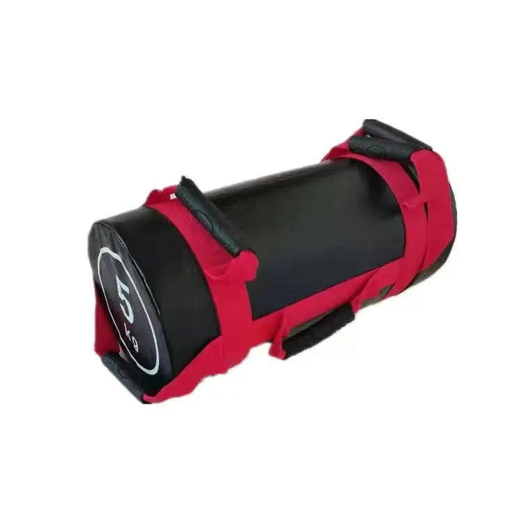 Flat white PVC fitness sandbag for weight training on a gym floor.