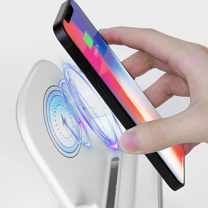 White vertical wireless charging stand for phones with Type-C input on a desk