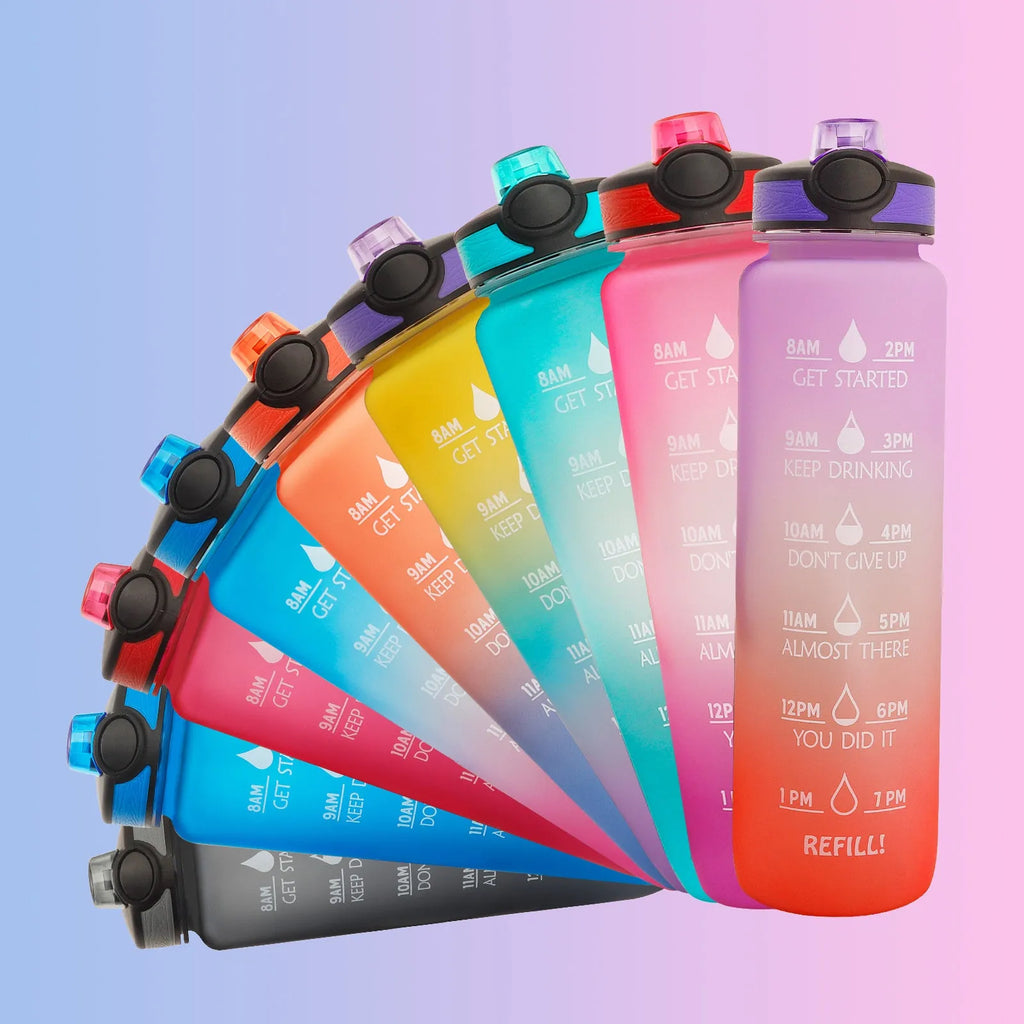 Blue-red gradient 1L Tritan water bottle with time markers and flip-top lid on a gym bag