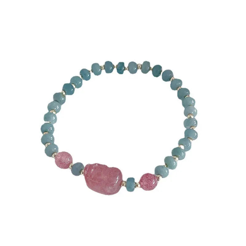 Women's simple jade bracelet with blue gourd charm and silver peace buckle on a beaded strand.