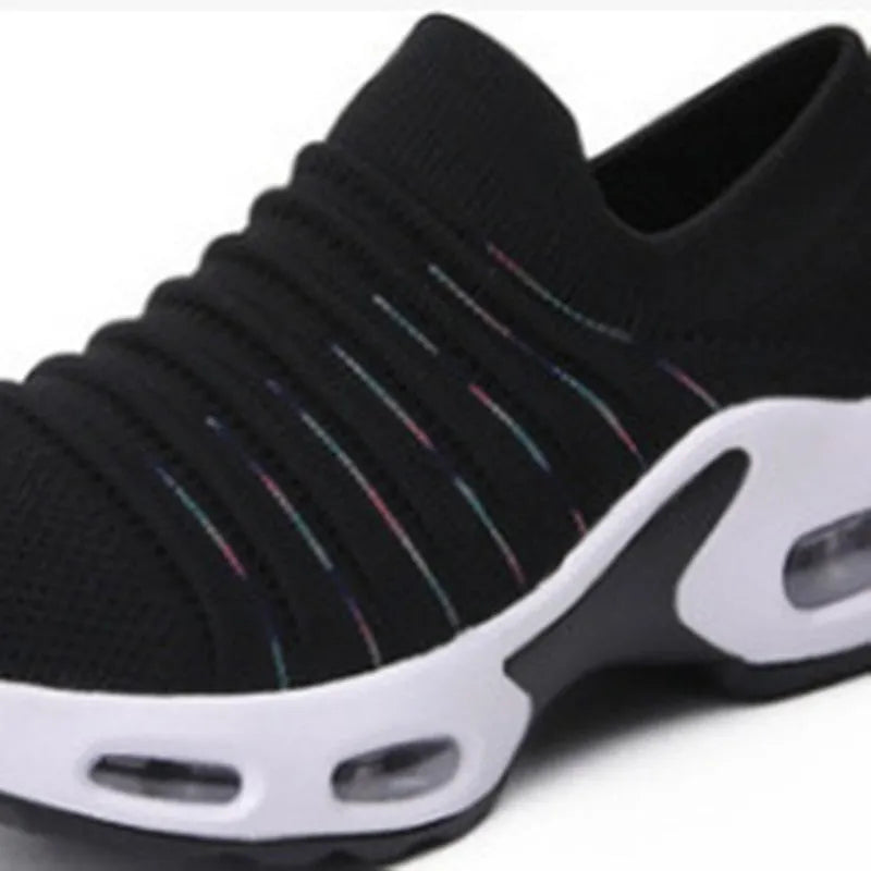 Plus size women's fly-knit socks shoes in light gray with mesh upper and low heel.