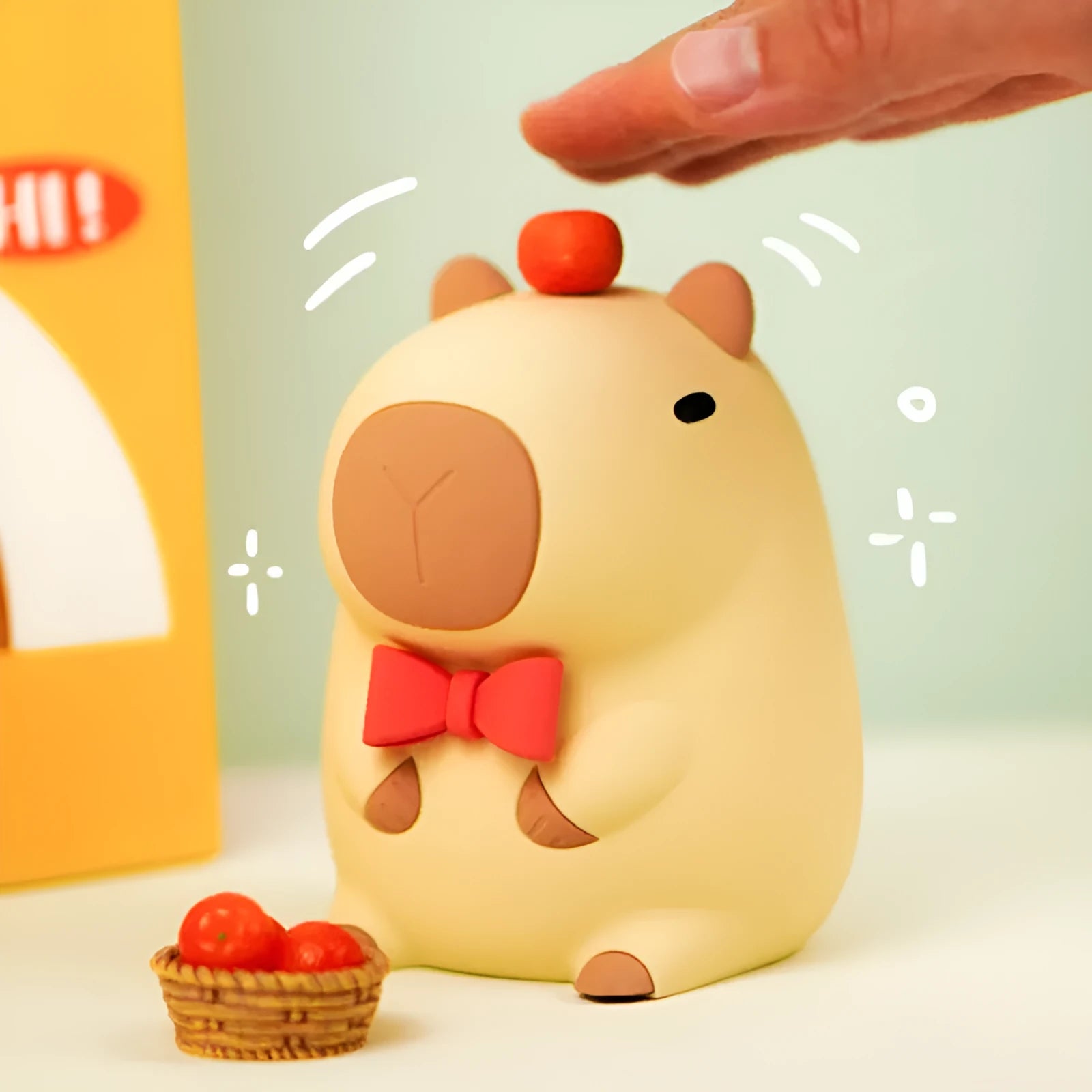 Cute capybara-shaped small night lamp on a table, showing its size and design.