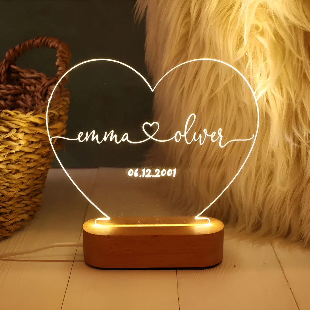 Custom transparent acrylic LED night light with personalised names and date engraving.