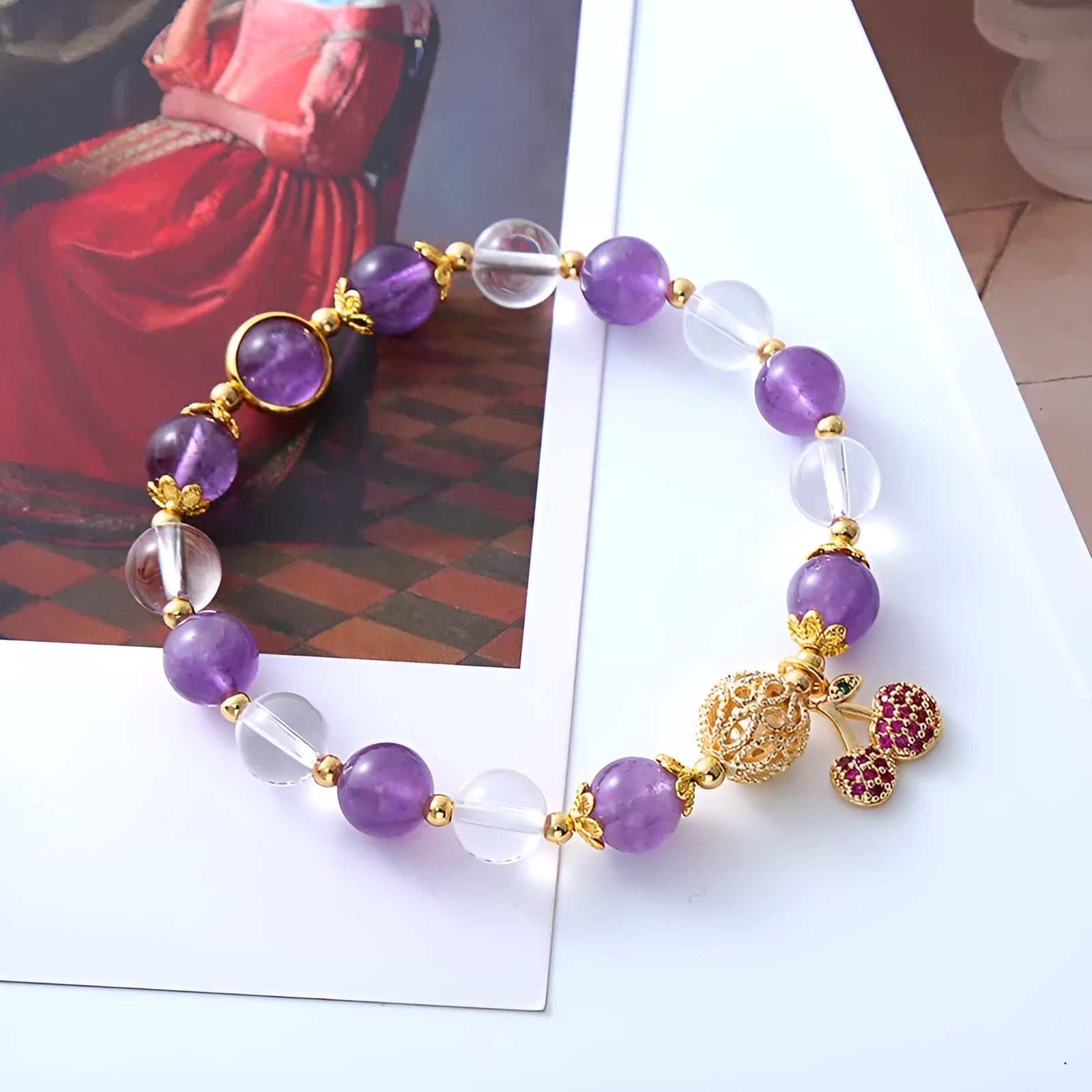 Handmade women's purple crystal bracelet with a micro-inlaid cherry flower charm.