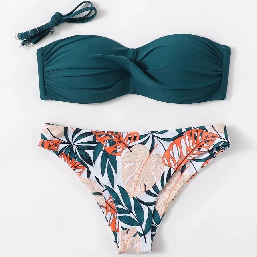 Green hard cup push up bikini swimsuit set with briefs bottom on a mannequin.