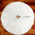 White plush Christmas tree skirt placed around base of decorated Christmas tree, 122cm size
