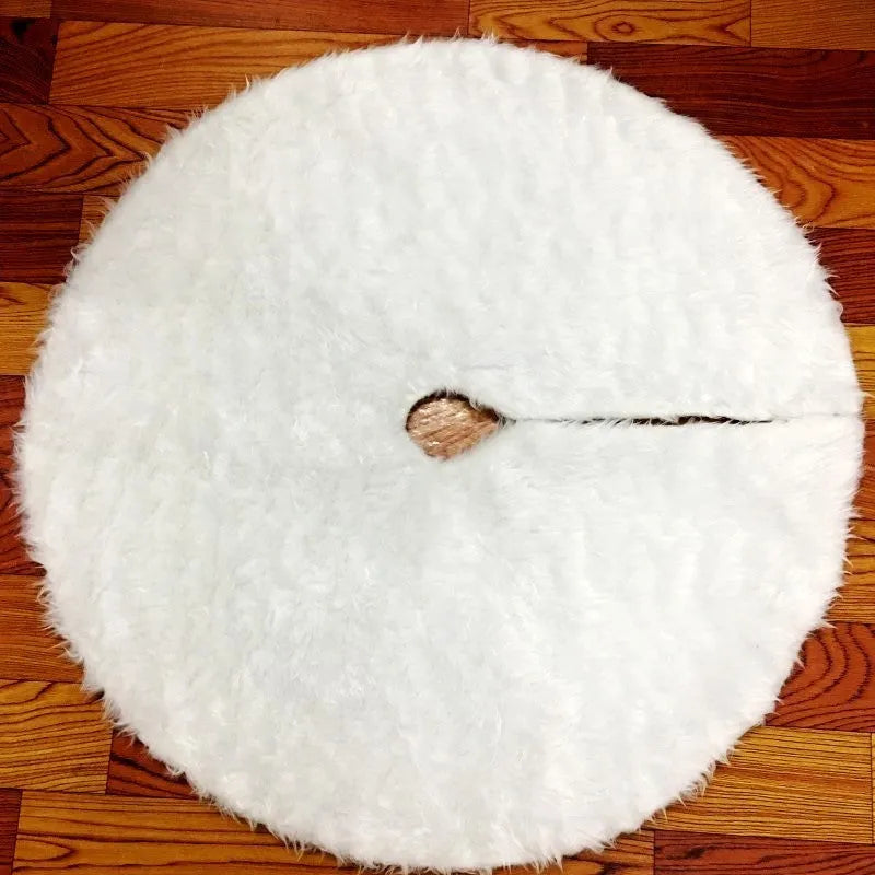 White plush Christmas tree skirt placed around base of decorated Christmas tree, 122cm size