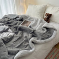 Simple leisure nap blanket in caramel coffee, 70x100cm, polyester fibre, solid colour, on a bed with modern simplicity decor