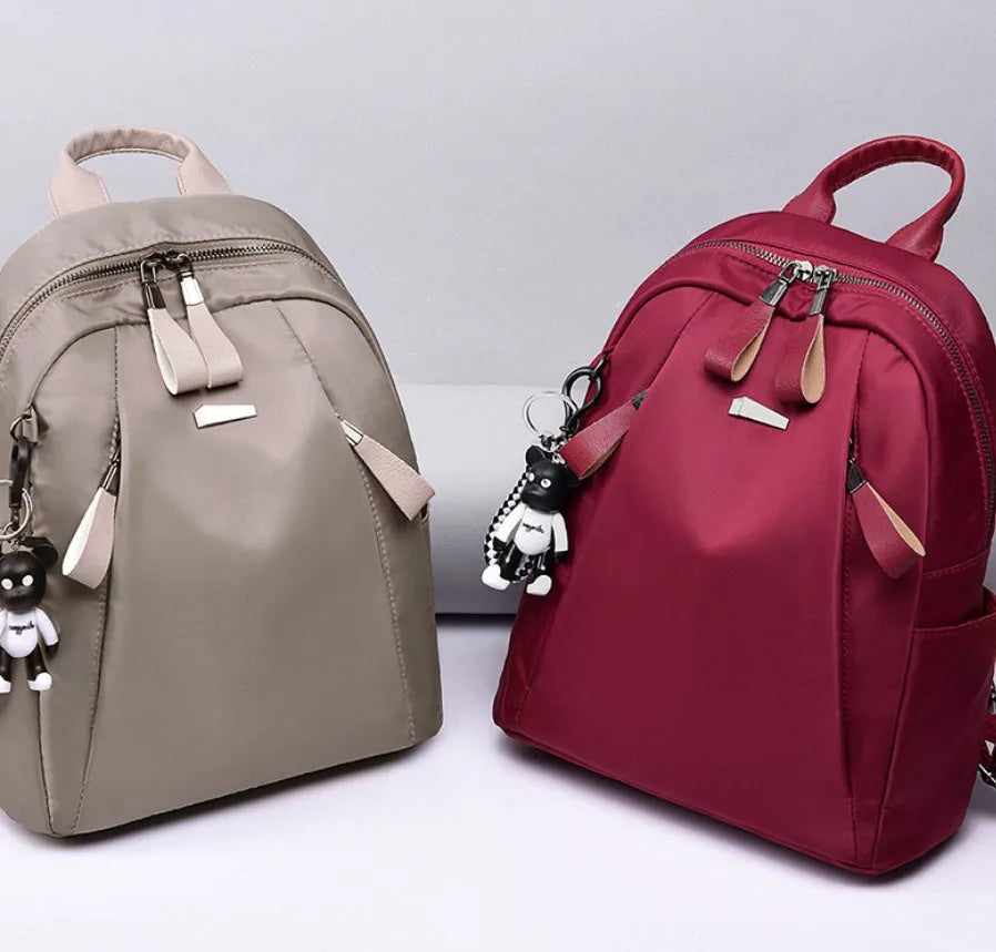 Medium square Oxford cloth rucksack in wine red with double straps and soft handle