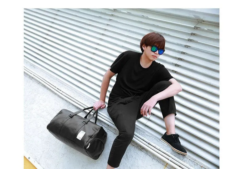 Black waterproof unisex sports fitness bag with diagonal straps and separate shoe compartments