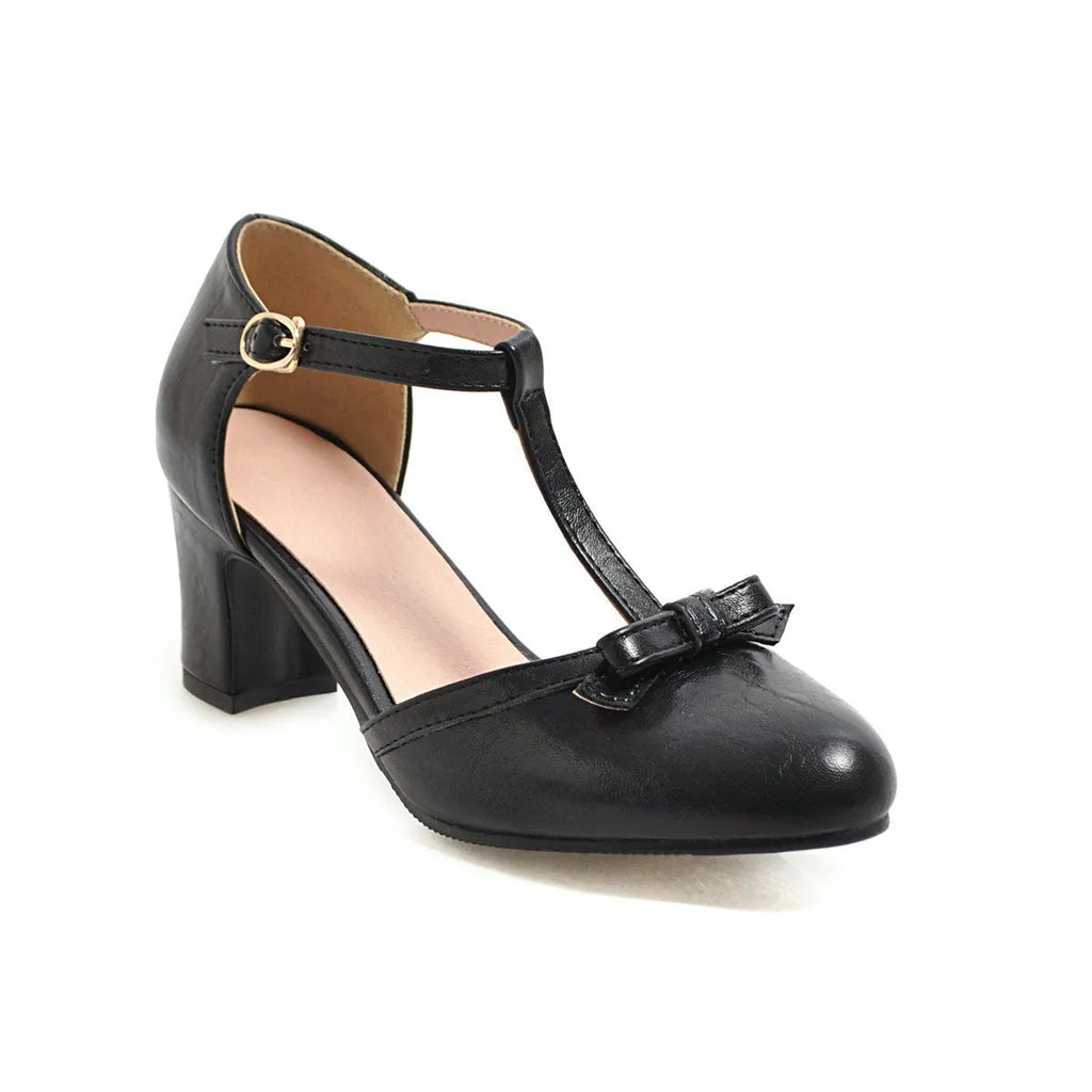 Yellow women's sandals with a chunky block heel, hollow-out design, and a buckle strap.