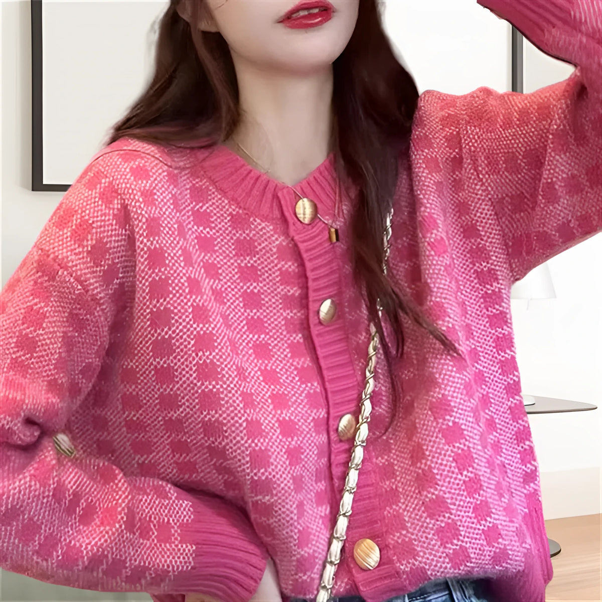 Pink plaid loose knit cardigan for women with button front, long sleeves, and 50cm length