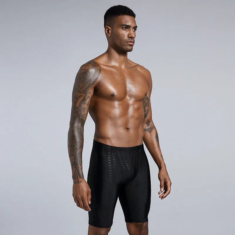 Men's solid colour swimming trunks in waterproof polyester fabric available in larger sizes