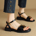 Women's brown leather sandals with a thick rubber sole and adjustable buckle strap.