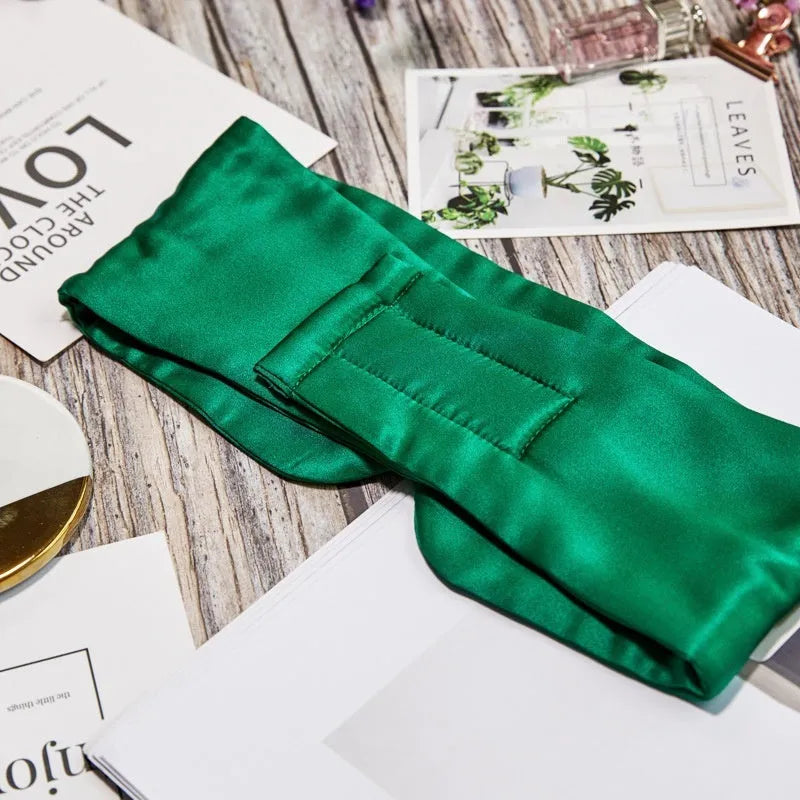 Silk sleep eye mask in multiple colours including black, champagne gold, and navy blue.