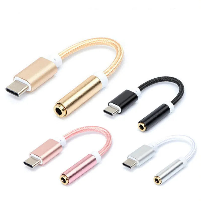 Close-up of a short black nylon Type-C to 3.5mm female audio adapter cable on a white background.