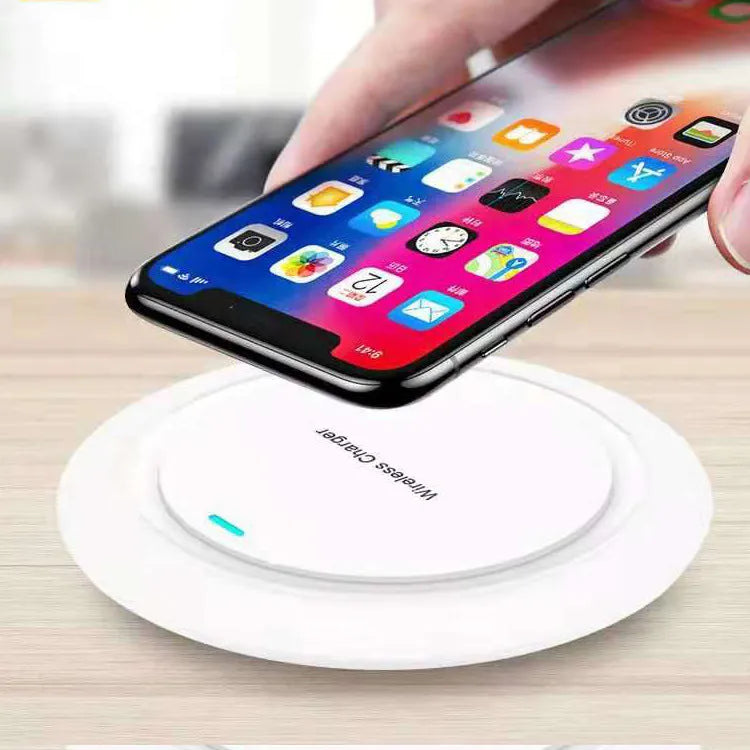 Round white desktop wireless phone charger with 10W fast charging capability
